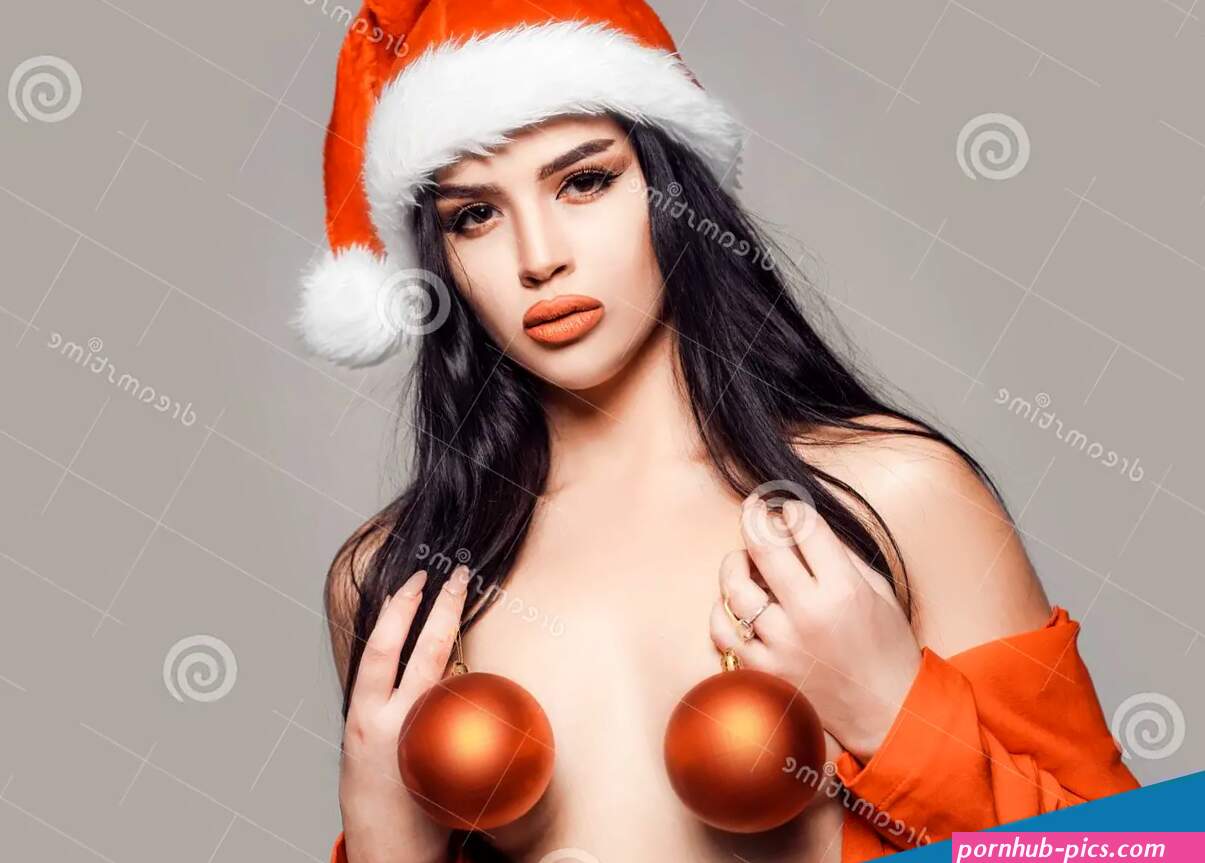 Red Christmas Balls with Boobs. Boobs and New Year Party. Naked Woman. Topless Santa Woman Stock Photo