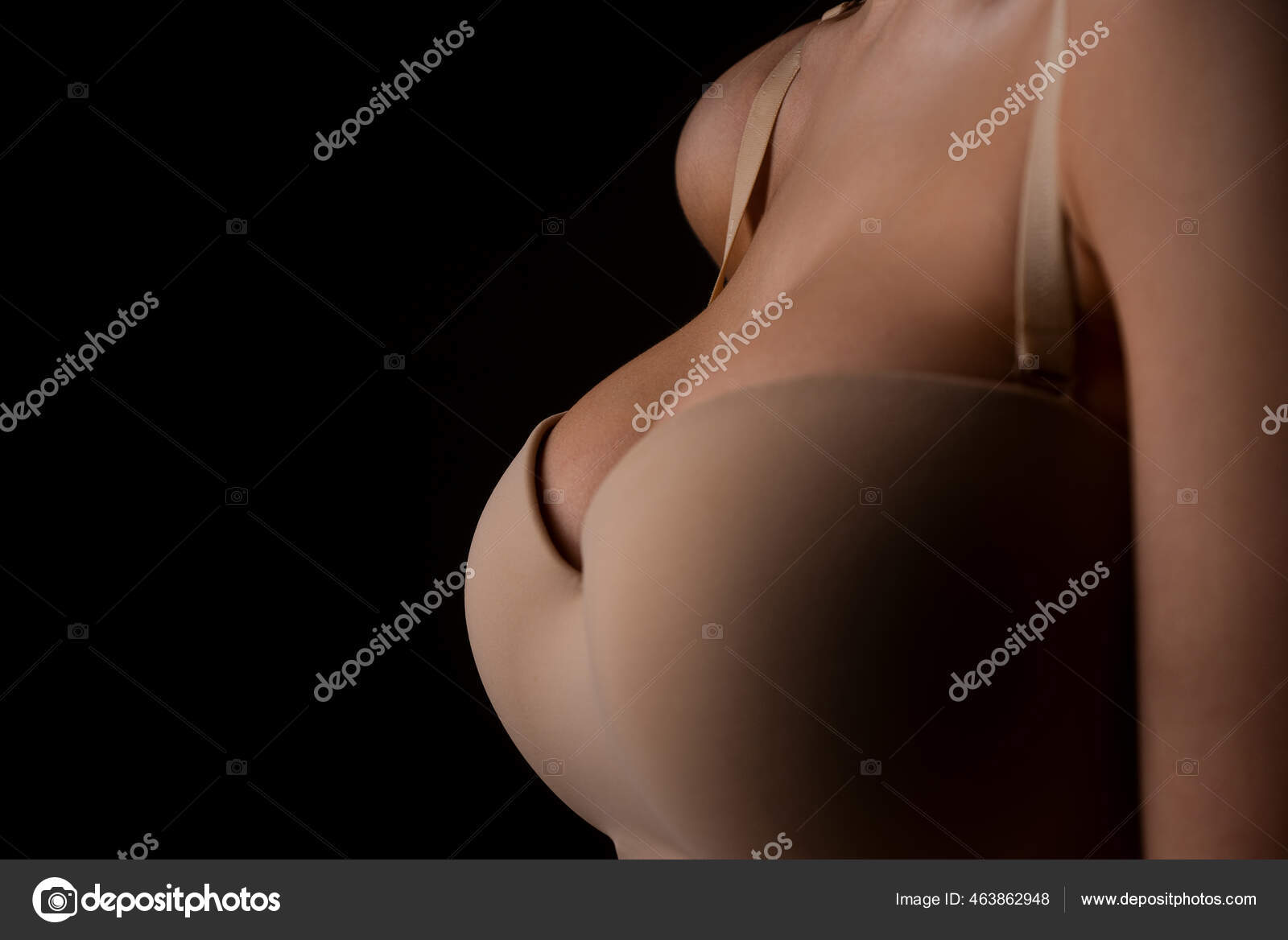 Closeup of sexy female boob in bra. Sexy boobs. Close up of breast of girl presenting her bra. Natural sexy boobs in lingerie. Plastic surgery. Copy space. Stock Photo