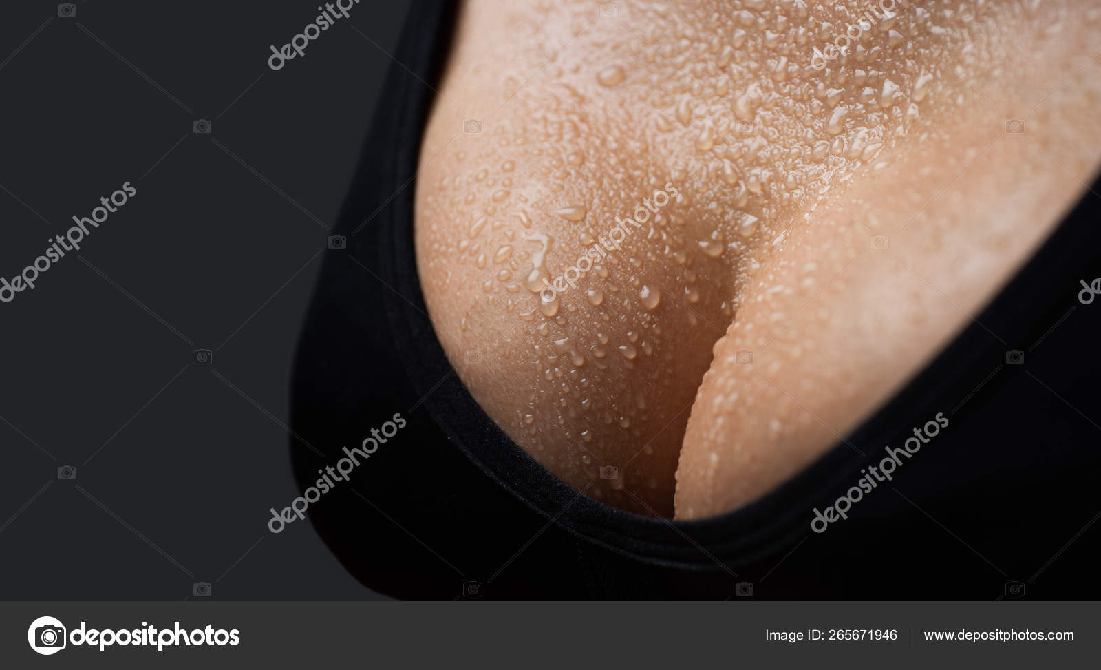 Sexy boob. Close up of breast of girl presenting her bra. Woman with big natural sexy