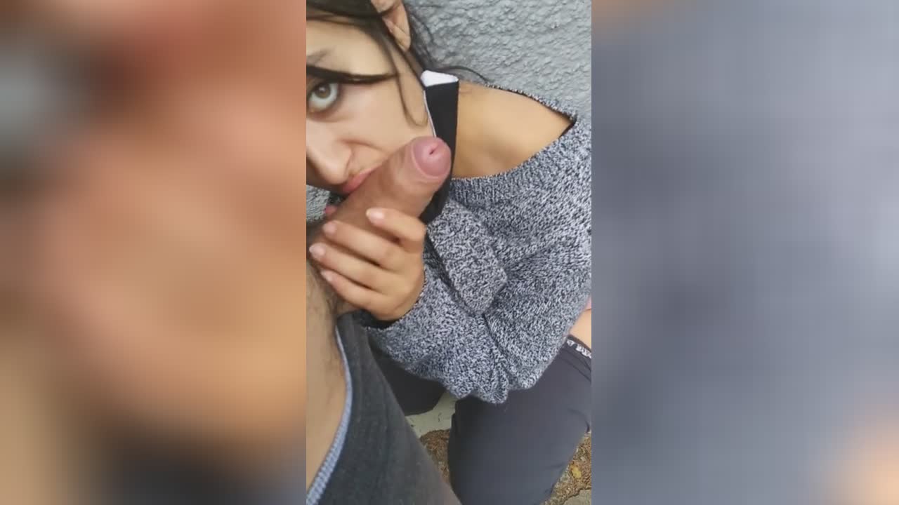 A brunette teen wearing a mask in public with big boobs and a huge butt is approached by a stranger in public POV and gives a blowjob.