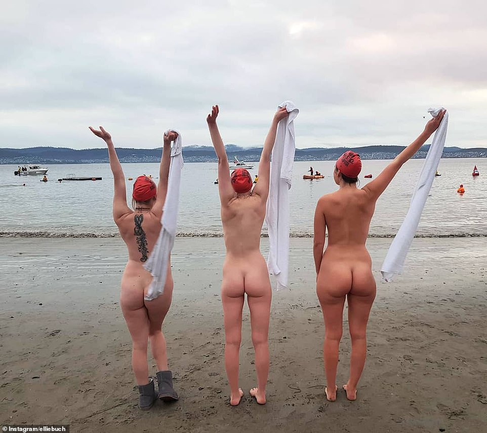 Thousands of naked swimmers brave near-freezing waters at the crack of dawn