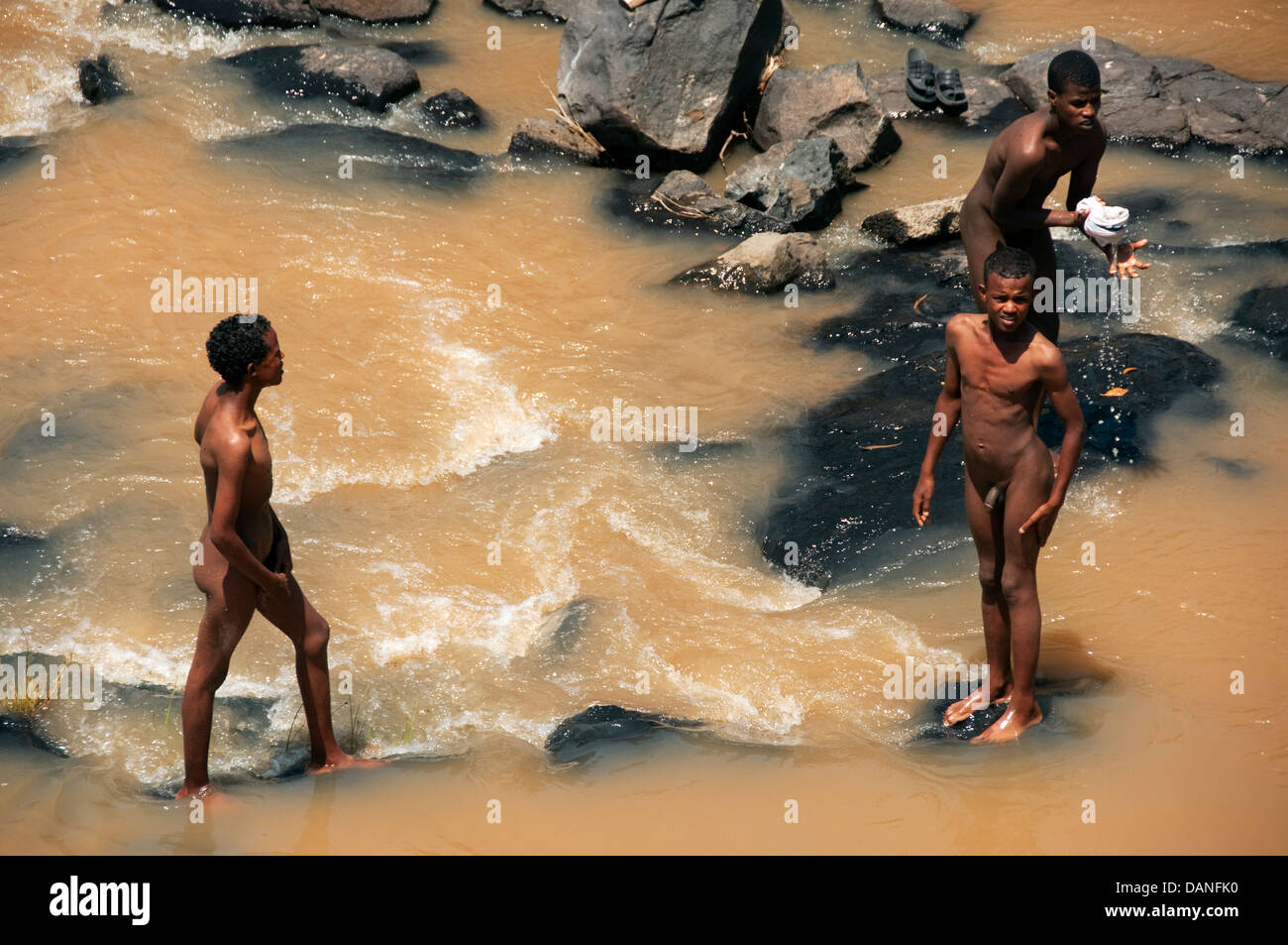 Naked boys having a bath on the river Oromia Region Southern Ethiopia Stock Photo