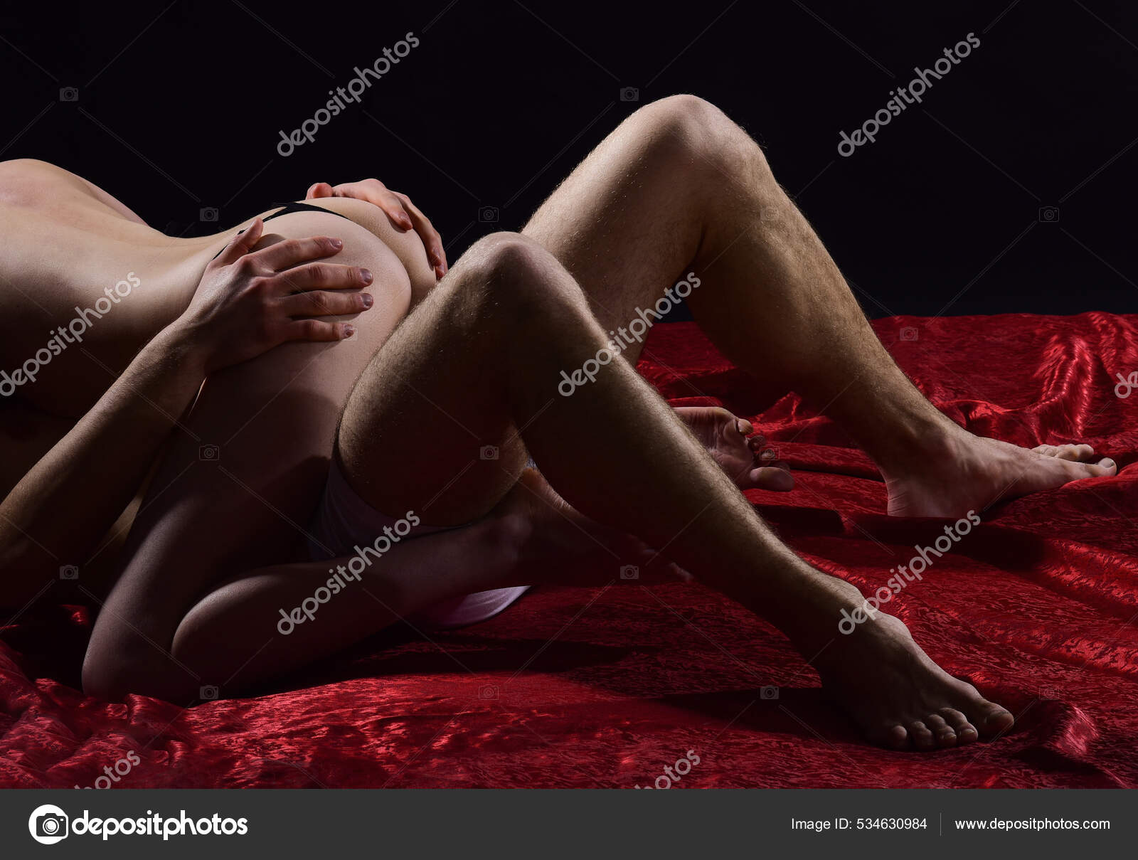 Romantic couple. sexy couple in bed. sensual couple in love. passion and desire. man and woman play erotic games. having sex. sexual intercourse. lovers naked body. orgasm. protect yourself Stock Photo