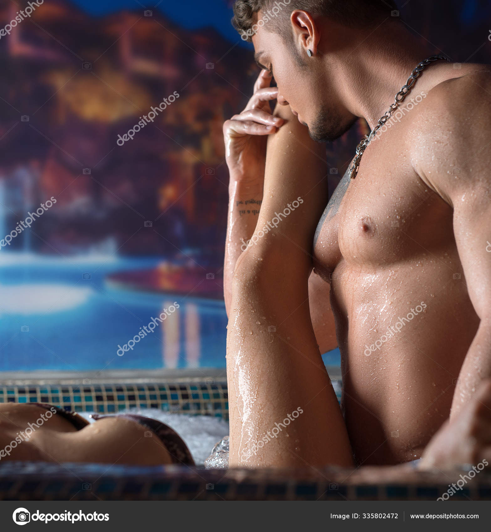 Young beautiful couple relaxing in swimming pool Stock Photo Wisky 335802472