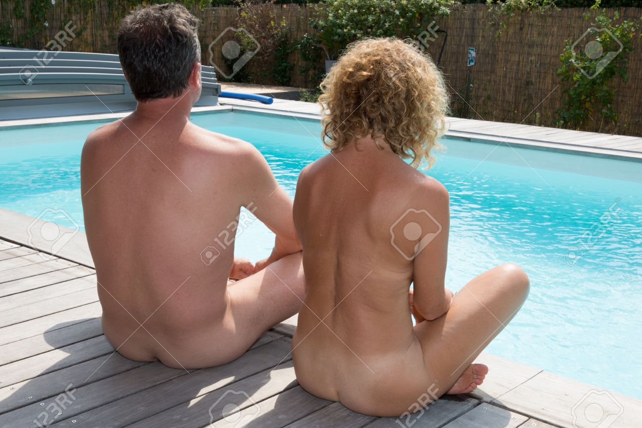 Relaxing Nudist Couple Sitting On The Swimming Pool At Summer Stock Photo Picture and Royalty Free Image. Image 62330523.