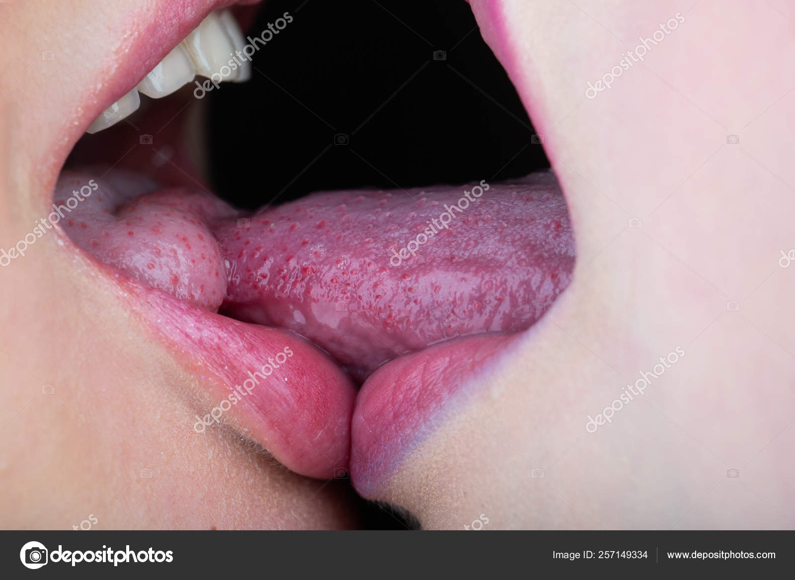 Lesbian kiss tongue. Girls kiss each other with tongue. Tender love. Sexy mouths together. Two girls during sex. Homosexual passion. Passion and seduction. Sensual intimacy. Stock Photo hannatv 257149334