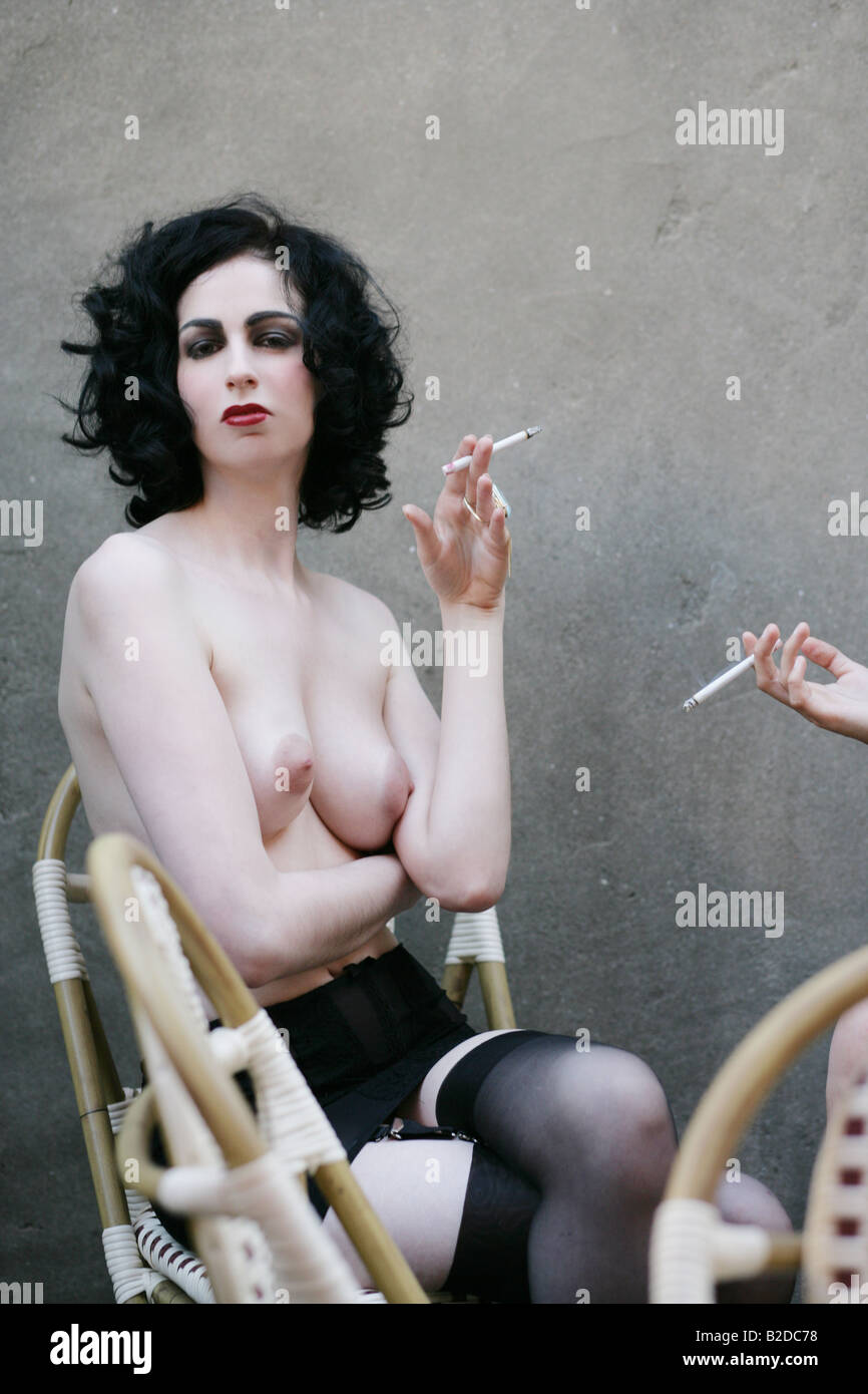 Young sexy nude women smoking Stock Photo