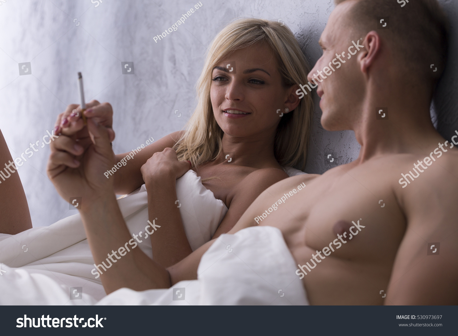 Young Naked Couple Smoking Bed After Stock Photo 530973697