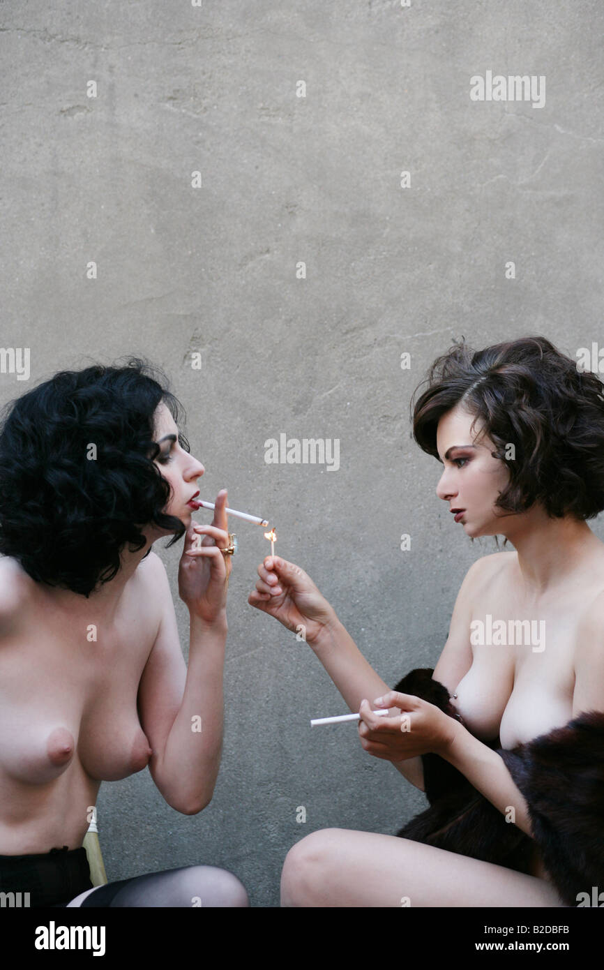 Young sexy nude women smoking Stock Photo