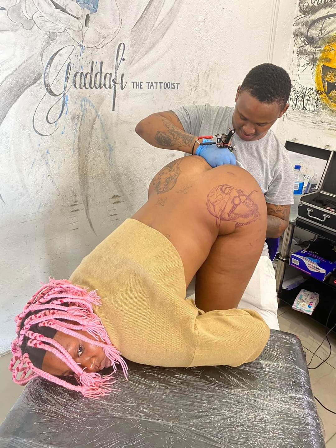 WATCH: Queen Minaj getting a tattoo naked
