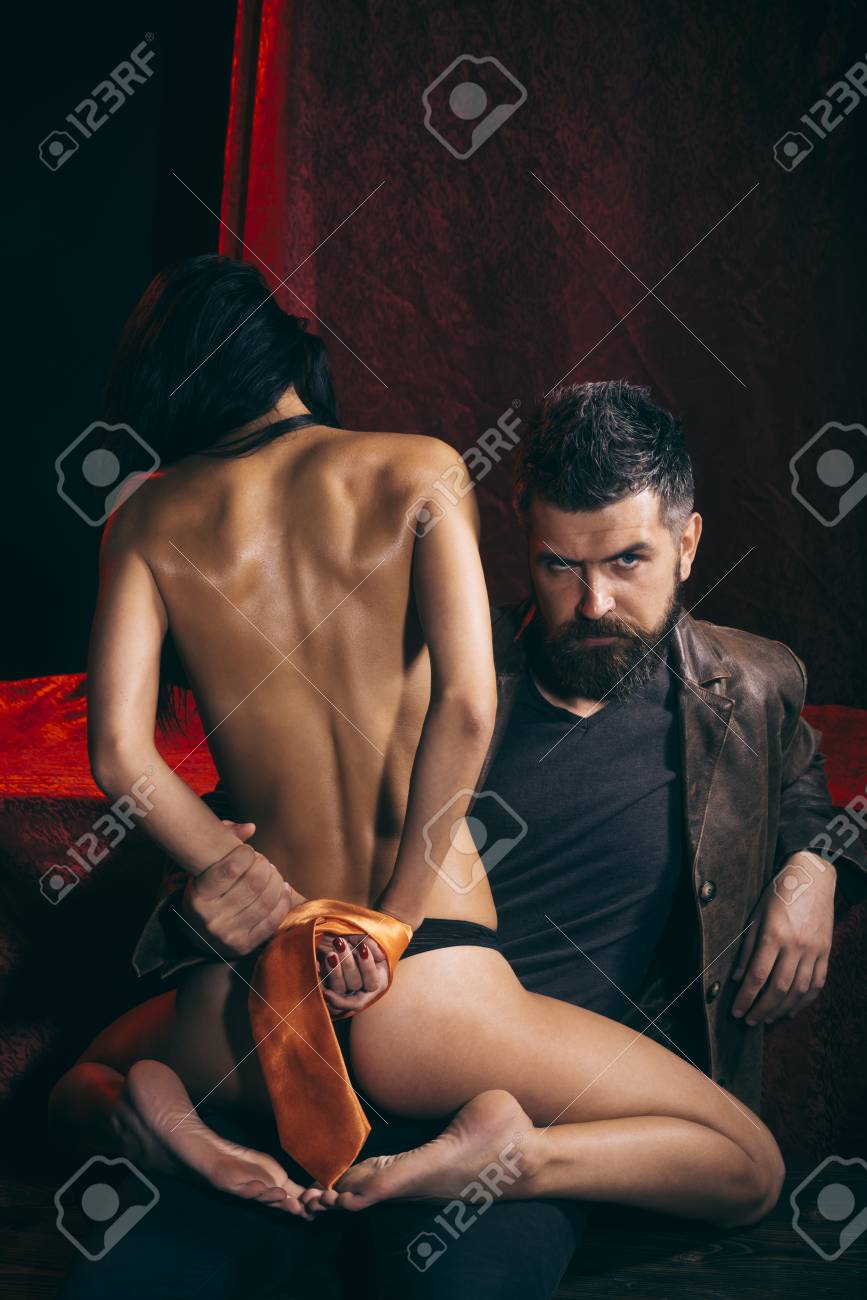 Sexy Woman With Tied Hands Buttocks. Couple In Love Bdsm Bearded Man And Naked Girl. Erotic Games Sex Orgasm Girl And Man. Love Man And Woman With Tied Hand. Dominance And Submission