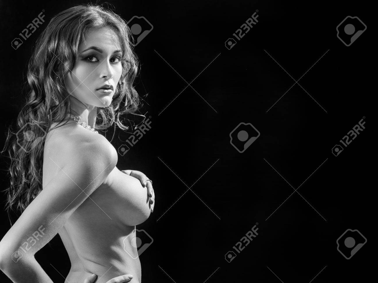 Beautiful Naked Girl Show Her Big Breast On Black Background Monochrome Image With Copyspace -. Image 57298880