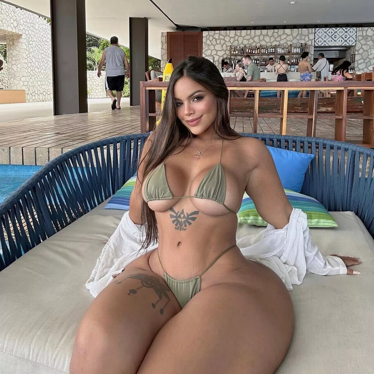 Curvy model addresses surgery rumours by showing what she used to look like
