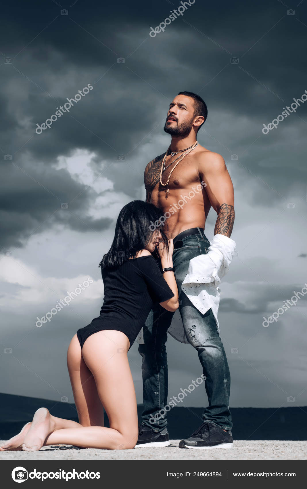 Erotica. Attractive couple beautiful young woman and man with perfect body. Sexy couple makes love passion. Stock Photo 249664894