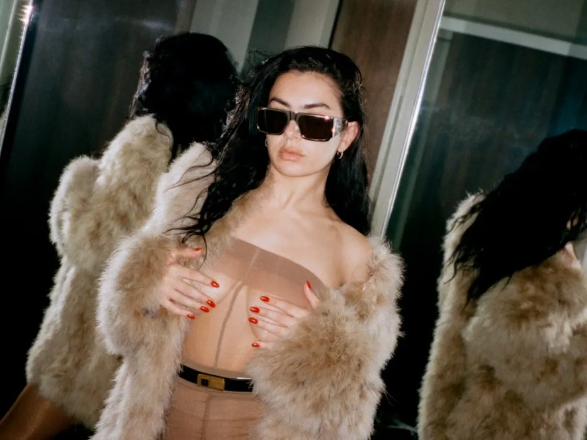 Charli XCX Frees the Nipple In a Nude Lingerie Dress For Sweat Tour