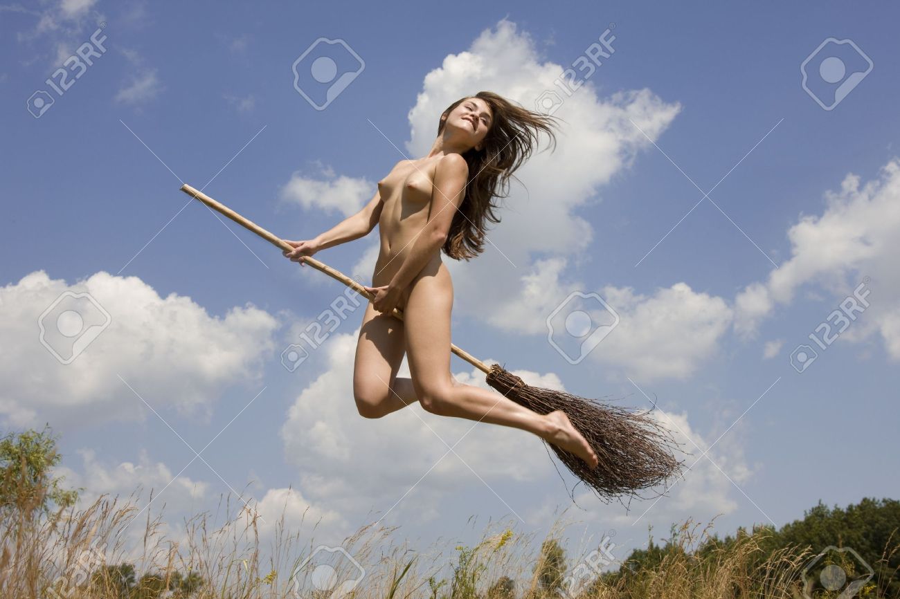 Young Naked Girl Jumping With A Broom Against A Background Of Blue Sky Stock Photo Picture and Royalty Free Image. Image 5010489.