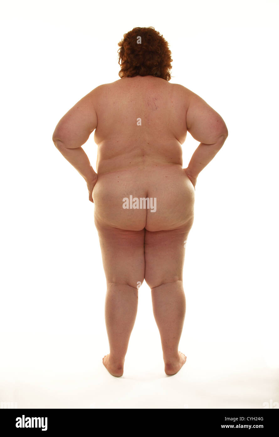 Fat naked woman standing against a white background Stock Photo