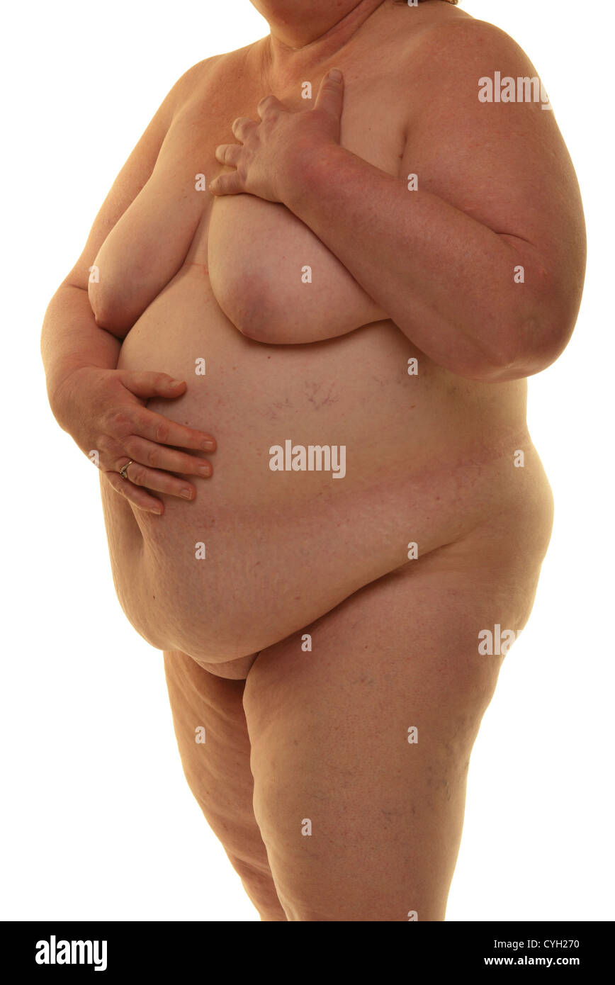 Fat naked woman standing against a white background Stock Photo