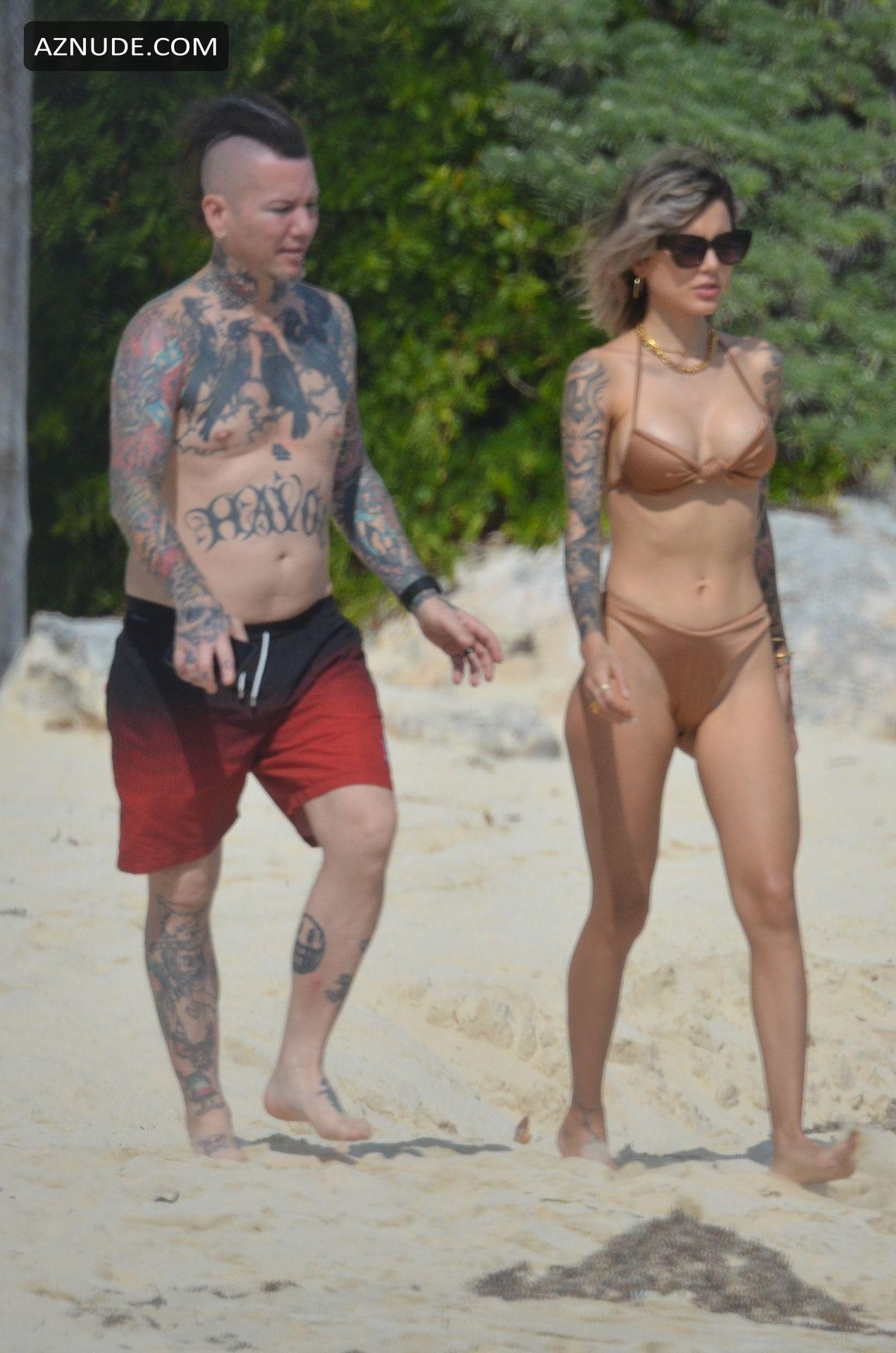 Nathalia Ashba pictured displaying their inked body while relaxing in Mexico