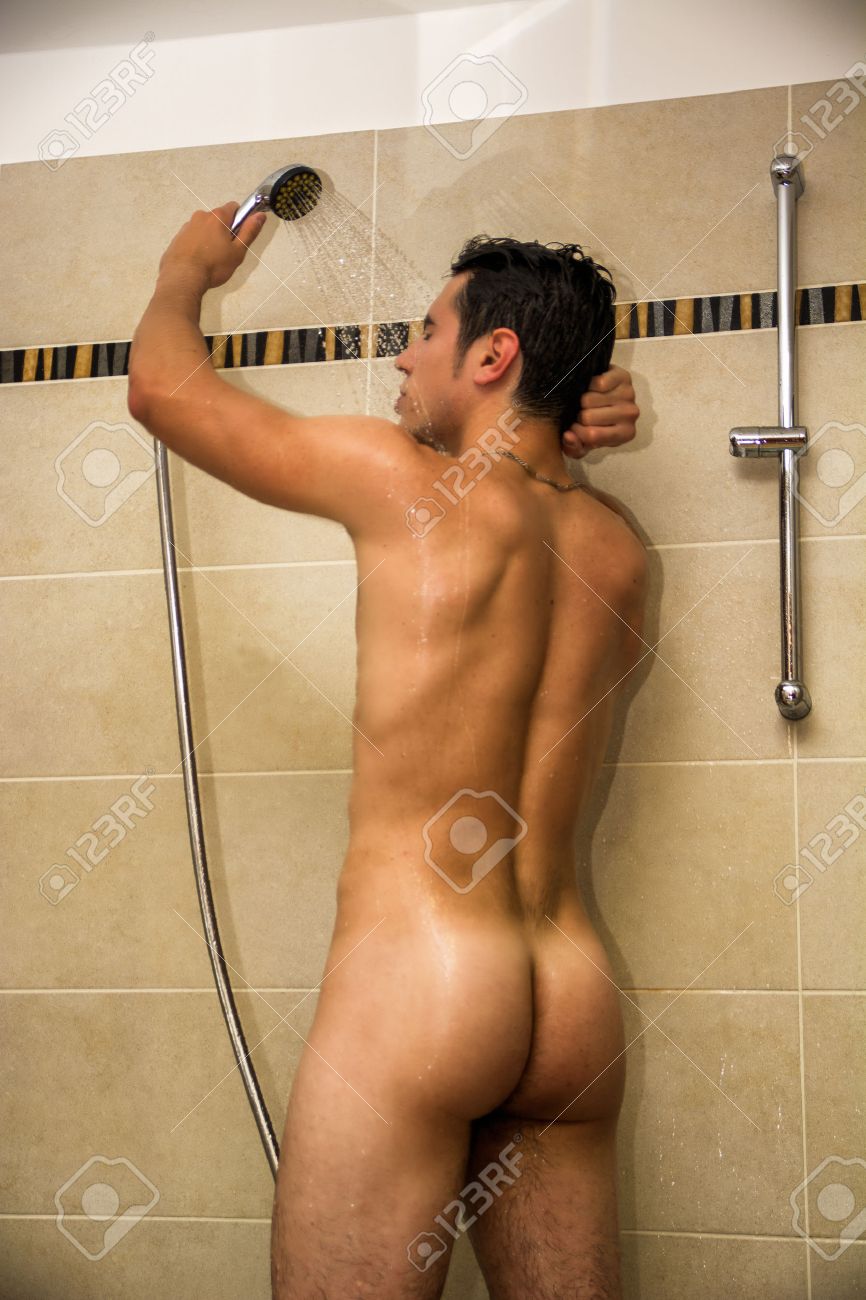 Naked Athletic Young Man Taking Shower At The Bathroom To Refresh While Holding The Shower Head. Stock Photo Picture and Royalty Free Image. Image 41513238.