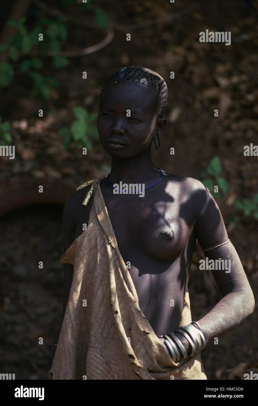 Mursi woman with her breast uncovered Omo River Ethiopia Stock Photo