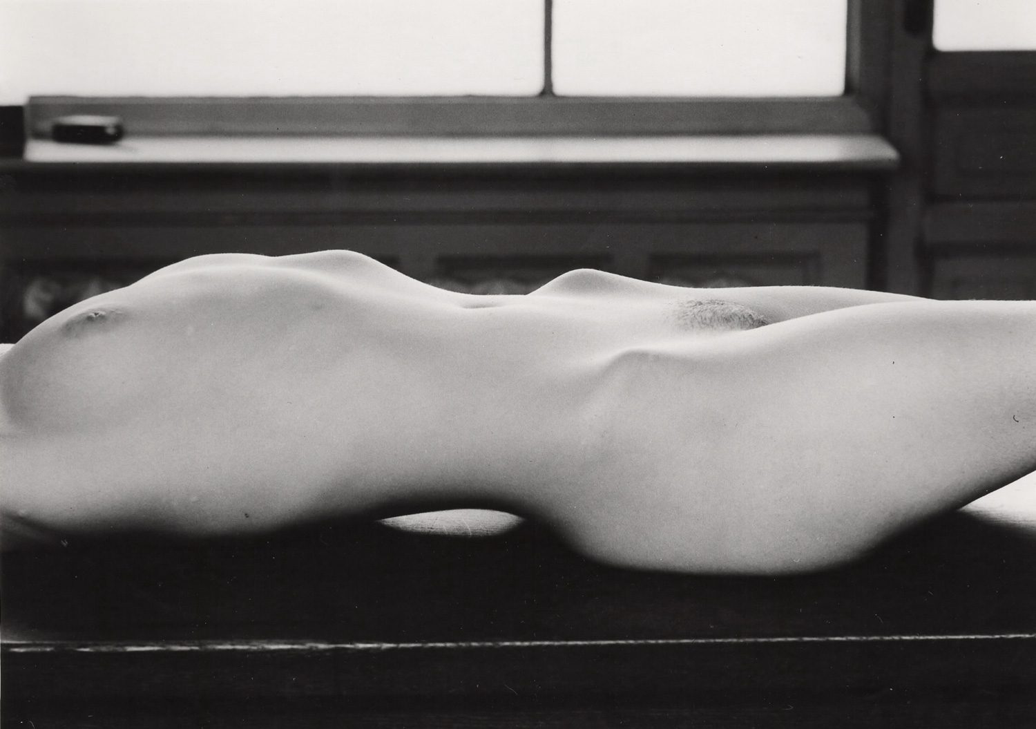 Untitled Nude laying on bench