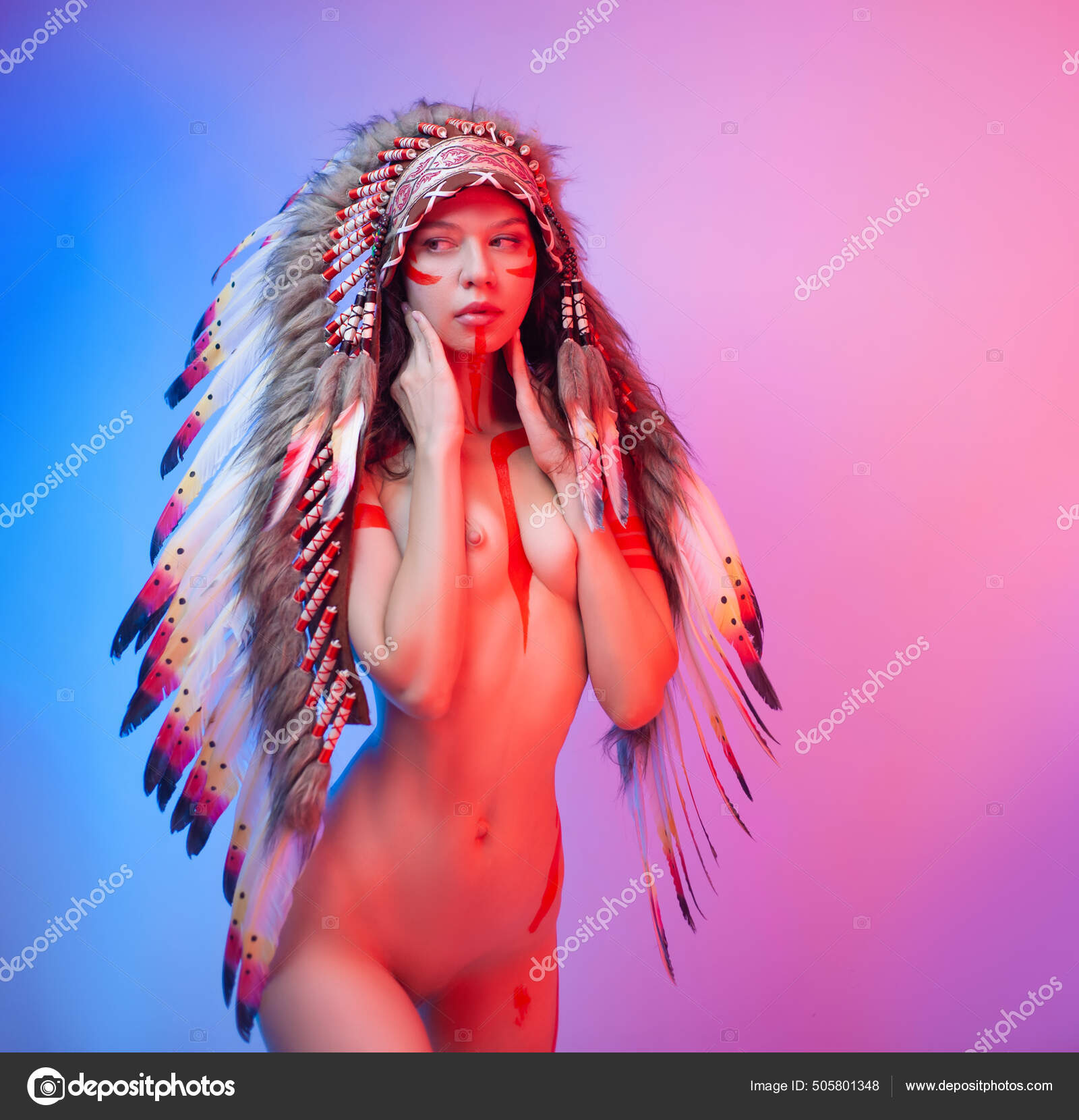 Naked woman in native american costume with feathers on a neon background Stock Photo artrotozwork 505801348