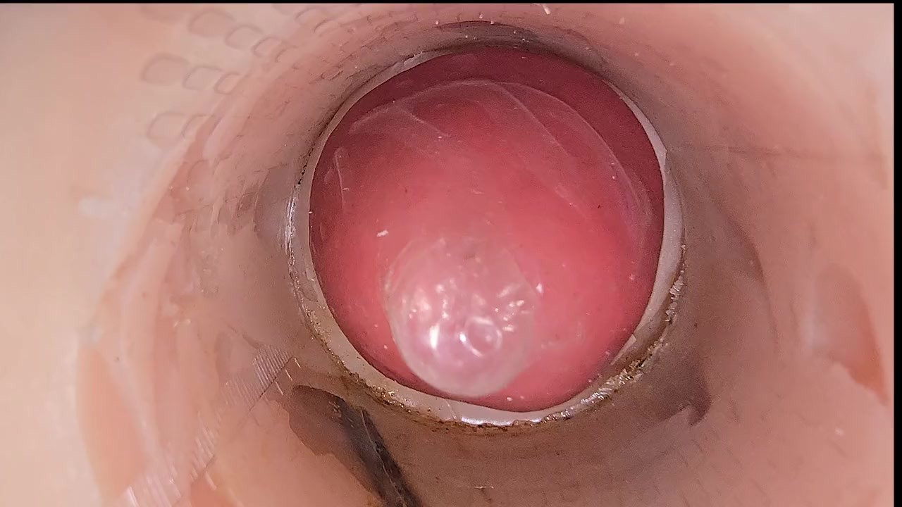 The camera in the deep pussy records a huge ejaculation of sperm into the condom