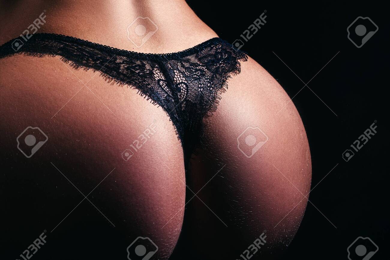 Perfect female body in shape with sexy back and big Butt. Black lingerie. Beautiful butt ass in elegant black panties. Sexy butt black panties. Woman in lingerie close up. Womans buttocks in