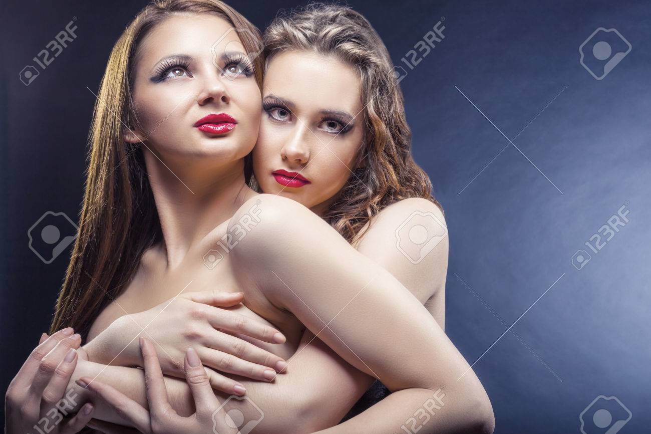 Two Beautiful Sexy Lesbians In Each Others Arms On Black Background Stock Photo Picture and Royalty Free Image. Image 68088879.