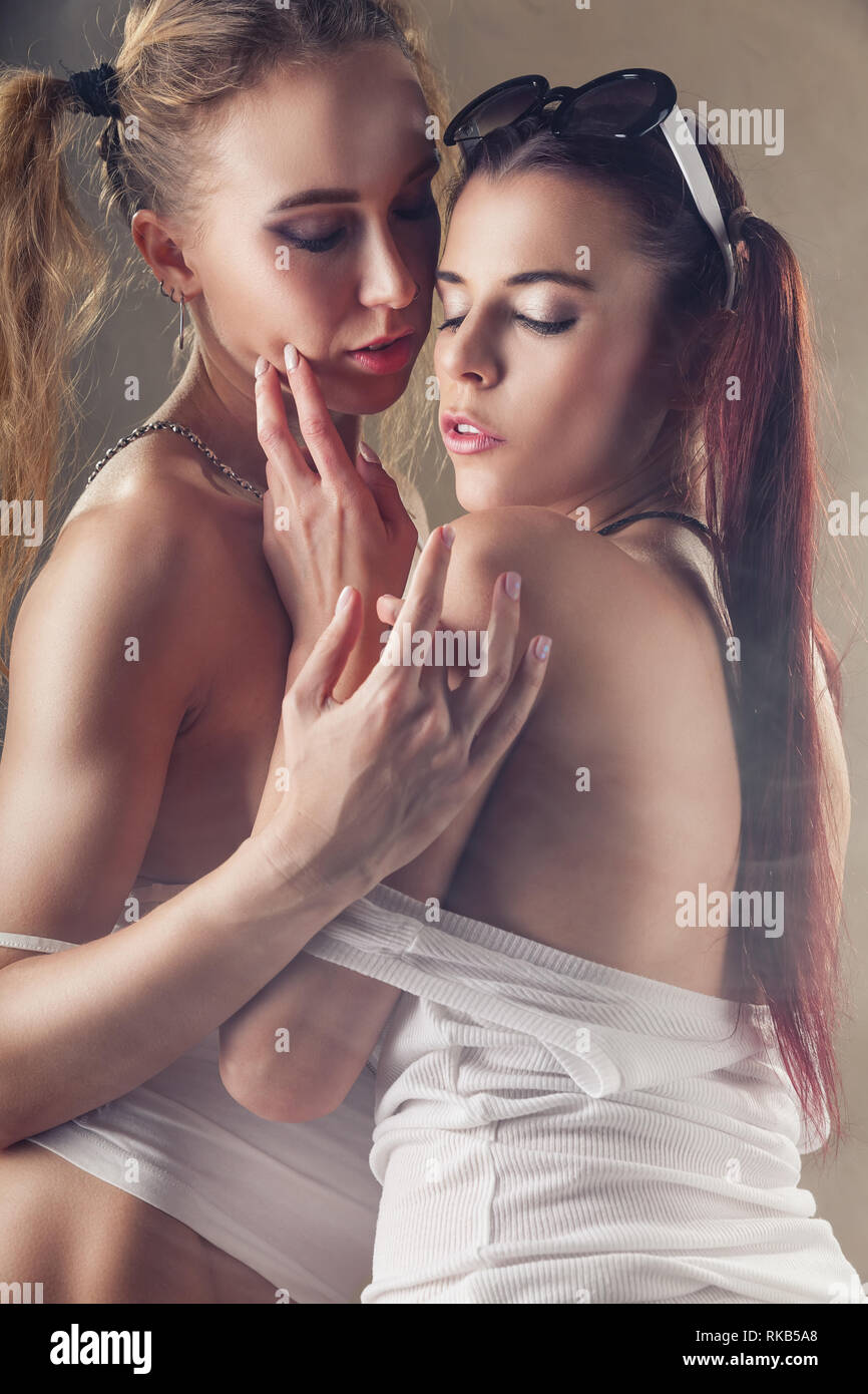 Lesbian girlfriends. Two sexy girlfriends in erotic foreplay Stock Photo