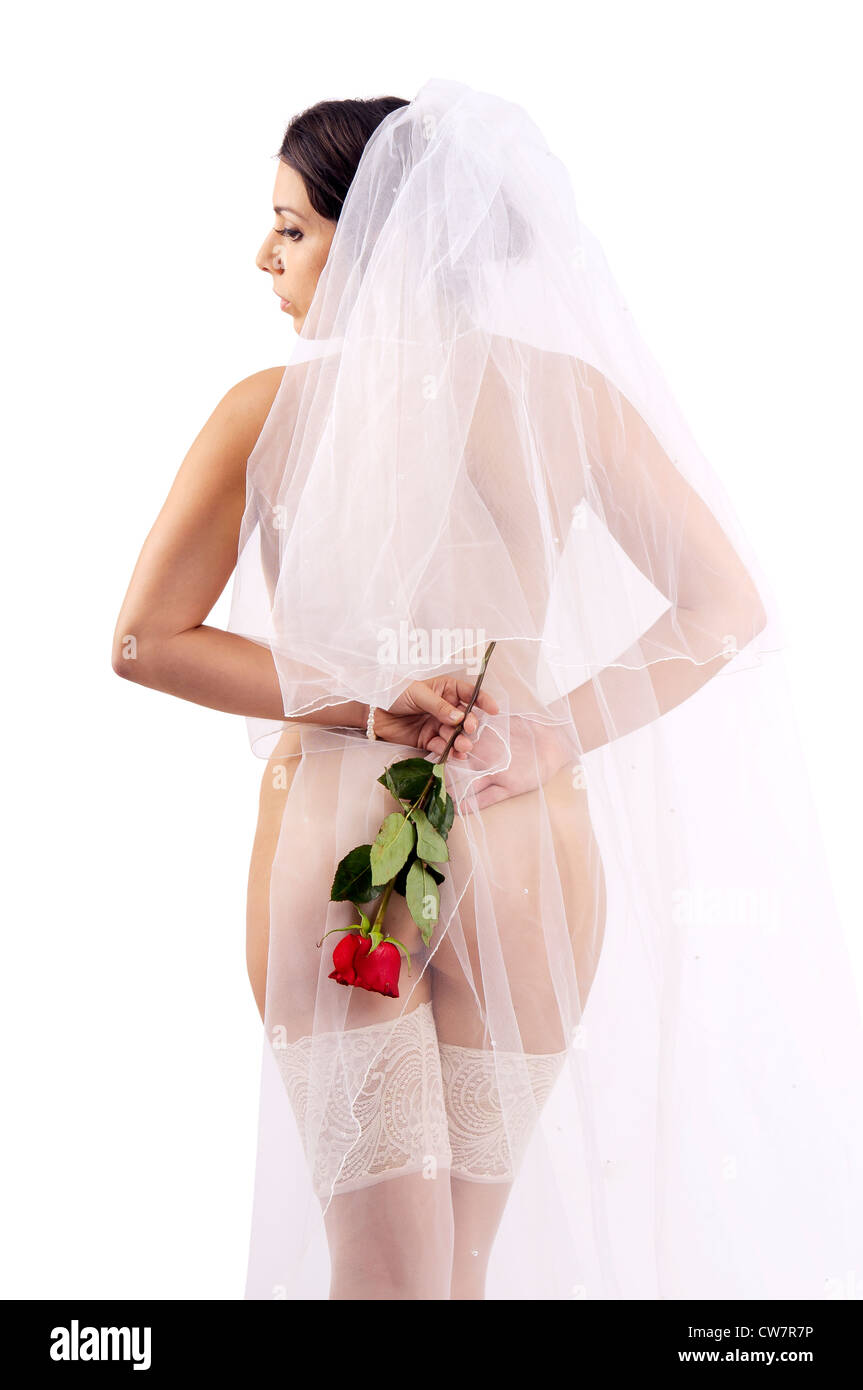 Beautiful bride posing nude with a rose Stock Photo