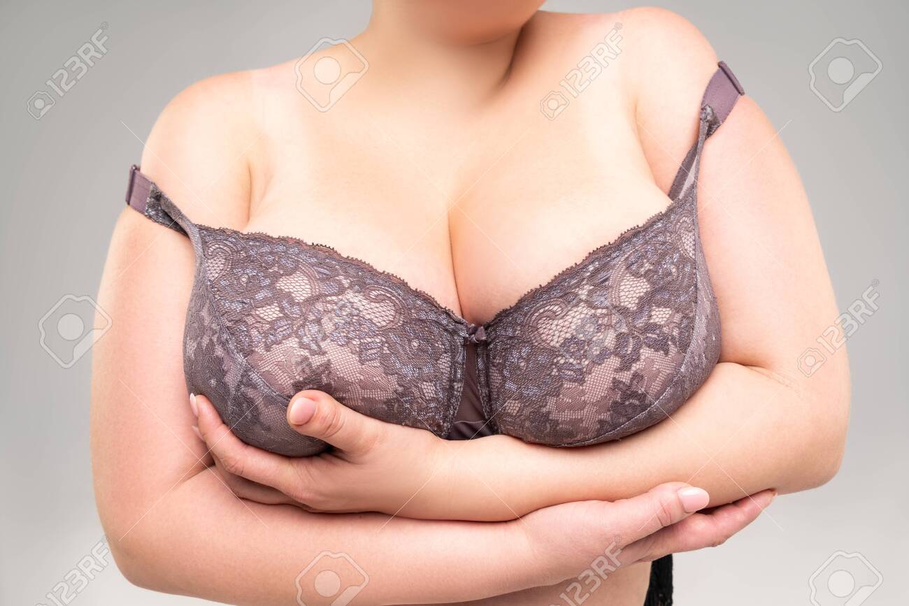 Big Natural Breasts In A Lace Bra Close-up Biggest Boobs On Gray Background Studio Shot Stock Photo Picture and Royalty Free Image. Image 157654412.