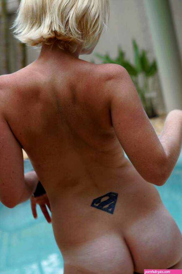 Blonde amateur shows off her tan lines by the pool at Brdteengal