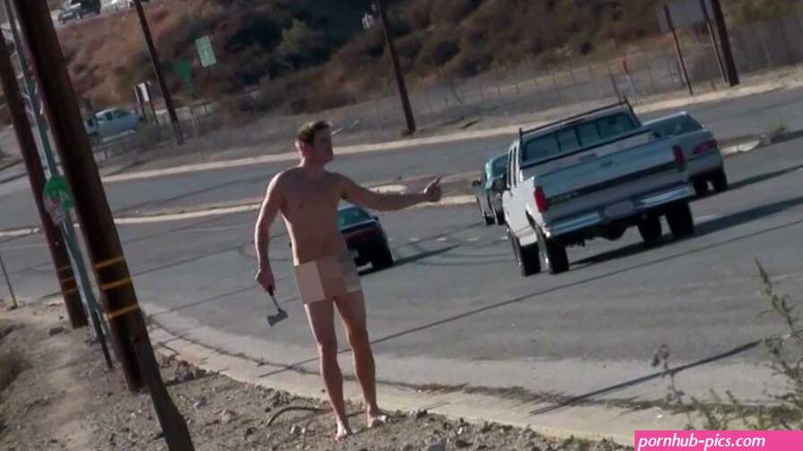 CRAZY NAKED GUY HITCH-HIKING WITH AN AXE