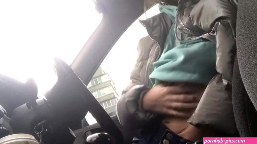 Naughty teen caught fingering her pussy in the car