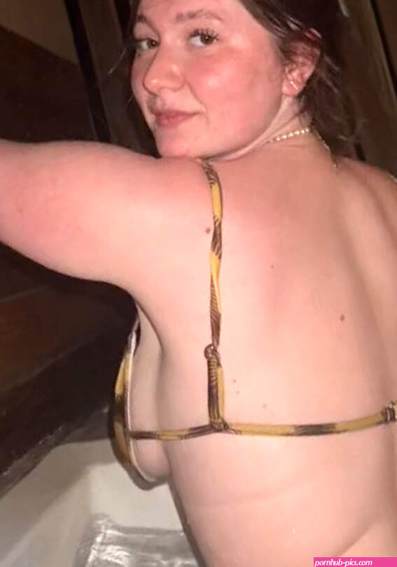 Emma Kenney nude side tits in a bikini in a hot tub 2022