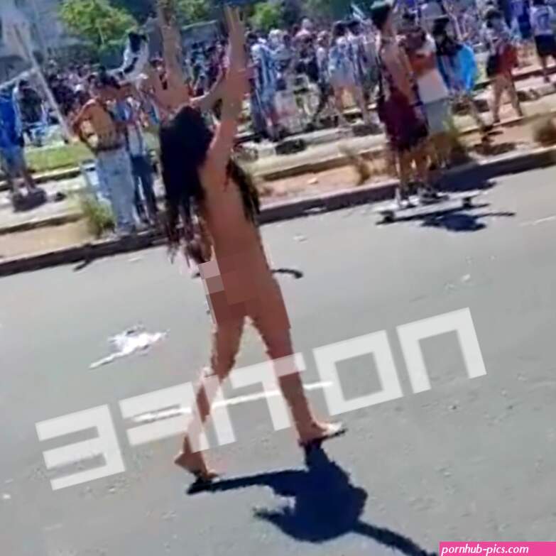 Watch as mystery brunette STRIPS NAKED to celebrate Argentina World Cup triumph in raucous Buenos Aires scenes
