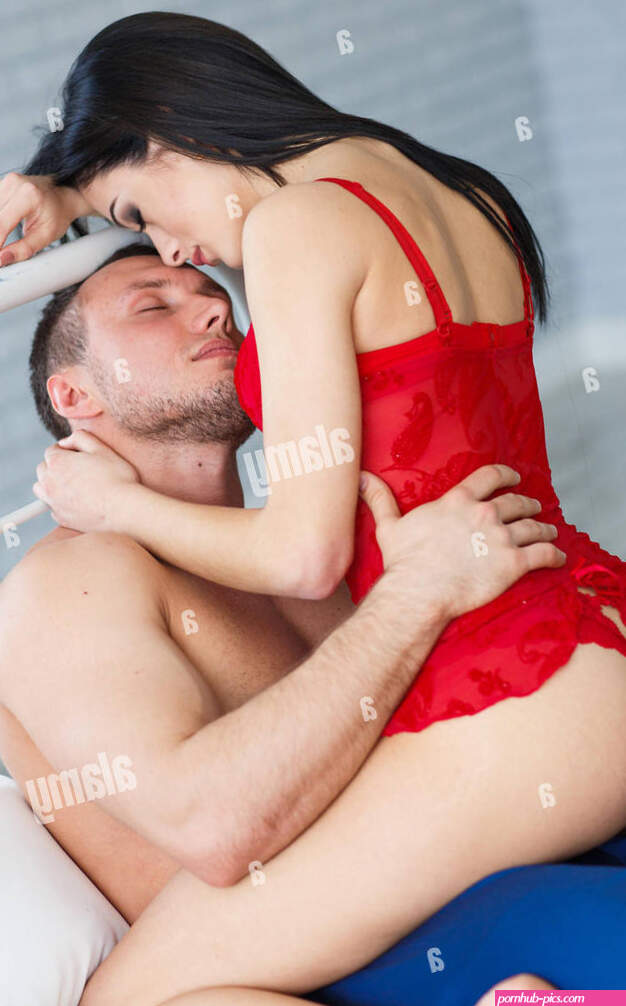 Sexy young couple kissing and playing in bed Stock Photo