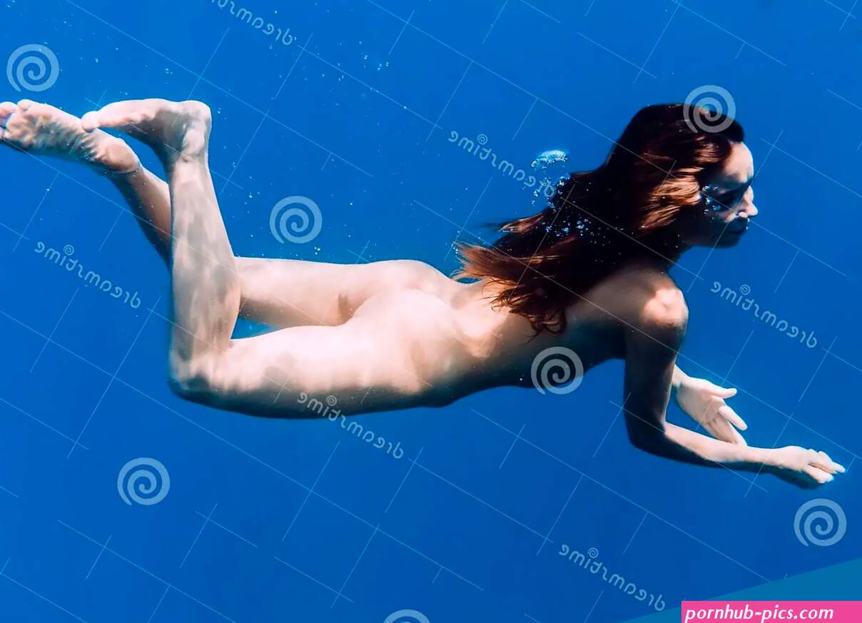 Naked Brunette Woman Dive in Sea Underwater in Tropical Ocean Stock Photo