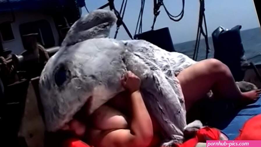 Huge bitch Tia Davis gets fucked and creamed by a man in a dolphin costume on the ship