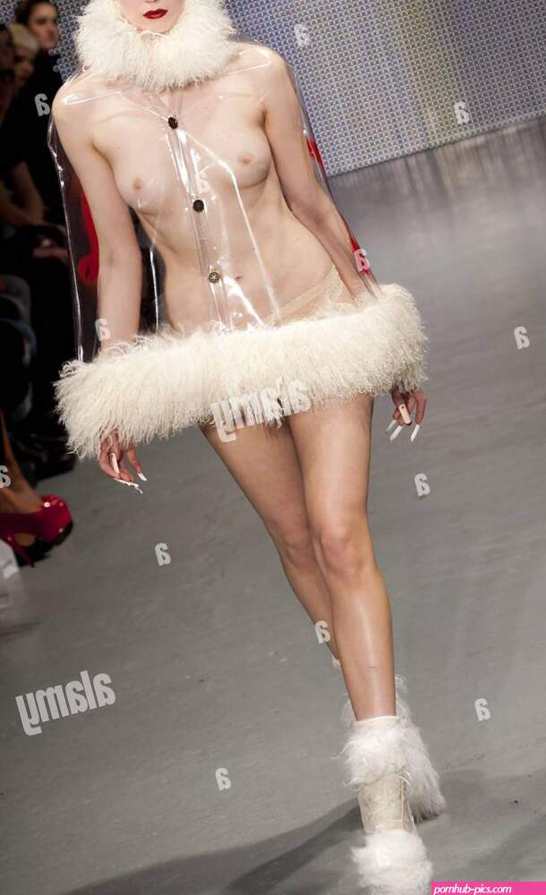 EDITORS NOTE NUDITY A model on the catwalk during the Charlie Le Mindu fashion show at the OnOff venue in central London as part of London Fashion Week Stock Photo