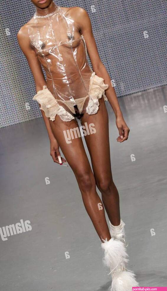 EDITORS NOTE NUDITY A model on the catwalk during the Charlie Le Mindu fashion show at the OnOff venue in central London as part of London Fashion Week Stock Photo