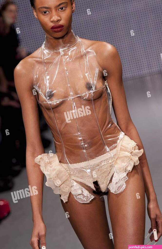 EDITORS NOTE NUDITY A model on the catwalk during the Charlie Le Mindu fashion show at the OnOff venue in central London as part of London Fashion Week Stock Photo