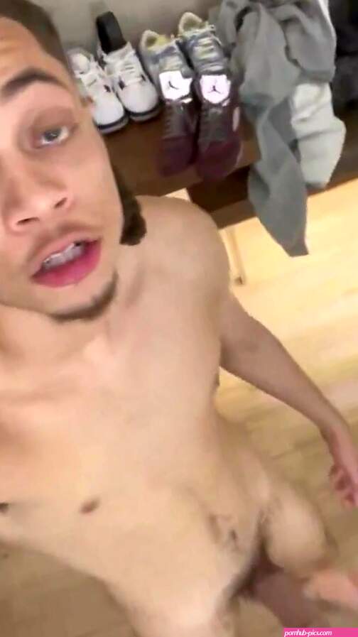 Cute light-skinned boy naked with a hard cock
