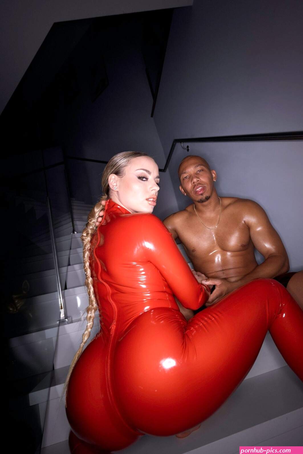 Blonde Anna Claire Clouds wearing red latex posing with Ricky Johnson 12 photos