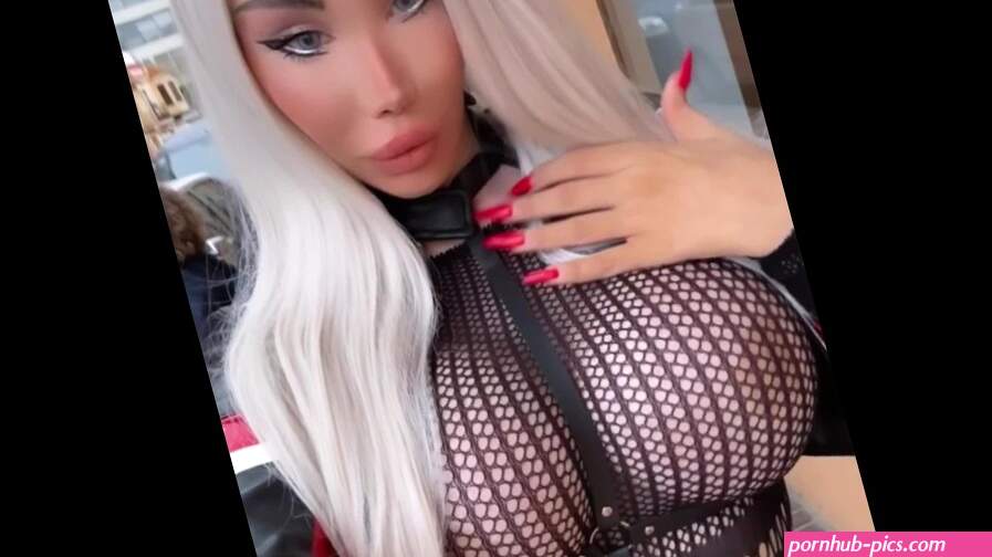 Hot blonde plastic MILF with big fake silicone tits walking in public