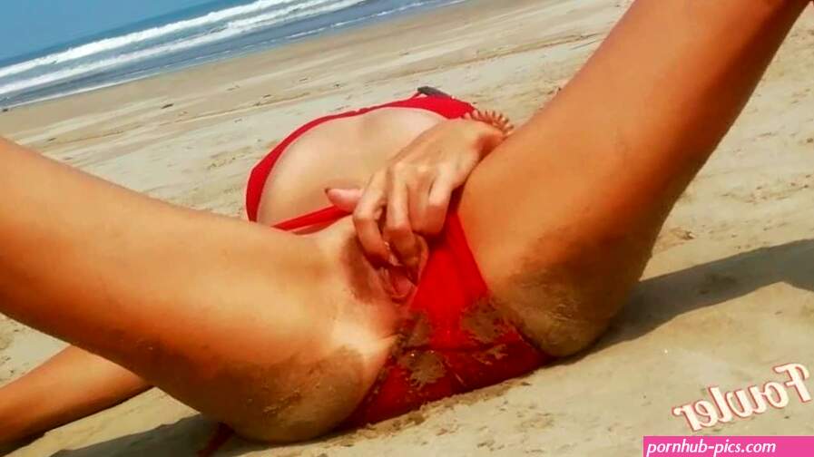 Hot Wet girl in red bikini flashing pussy on the sea beach