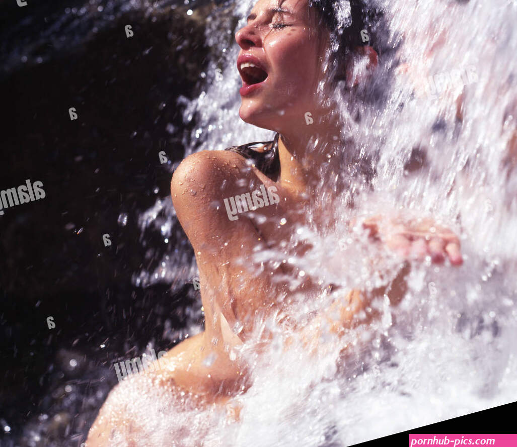 Woman naked nude outdoor outdoors bathing waterfall water brook stream creek bath wellness recreation na Stock Photo