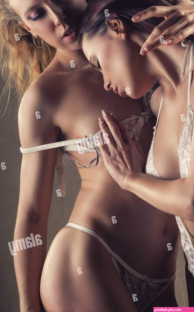 Two girlfriends in love. Two beautiful sexy lesbian women in erotic foreplay game Stock Photo